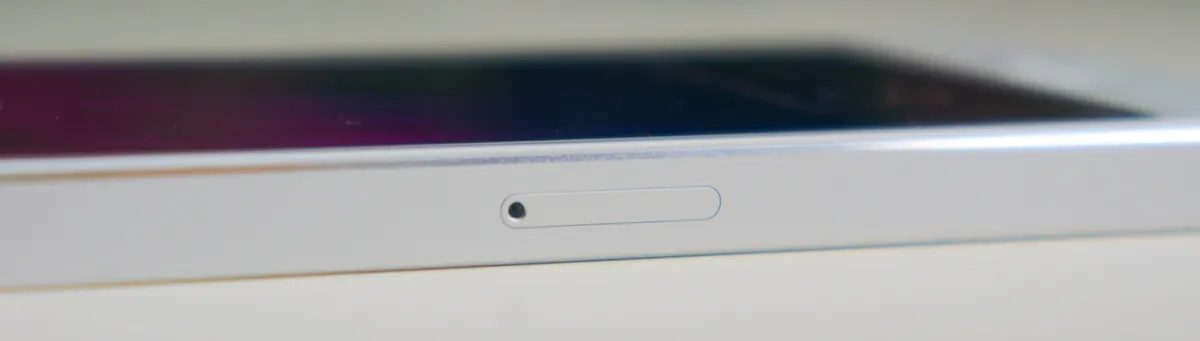 Close-up of the SIM card tray on an iPhone